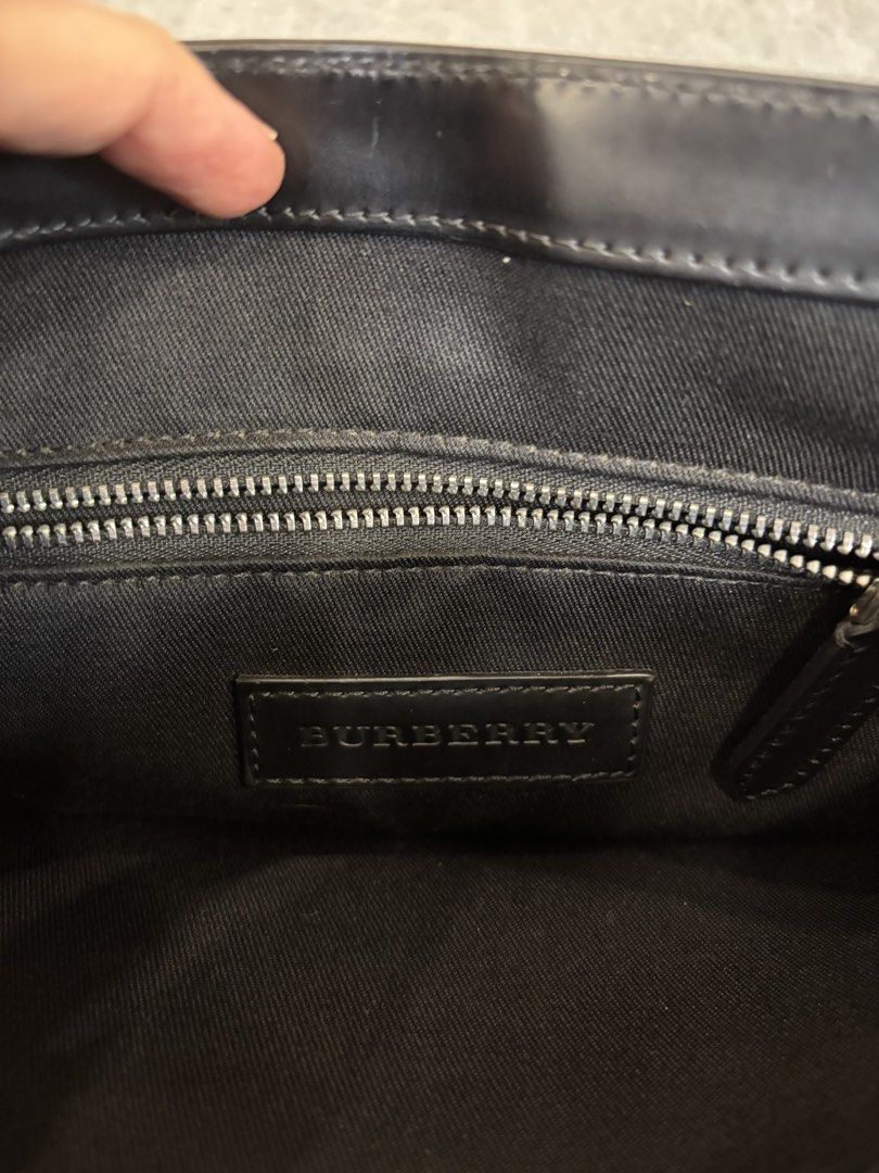 Pre-loved Burberry Nova Check Messenger Bag (Category: Luxury Bags & Wallets) located in Quezon City. Submitted by nikaikochan (Listing ID 1445903550, Image 2). Description: - Authentic Burberry messenger bag - Classic Nova Check pattern (dark grey & blue) - Adjustable strap for comfort - Exterior back zippered pocket - Interior zip pocket with Burberry logo - Minor scuffing on exterior coating (top flap) - Interior is clean.