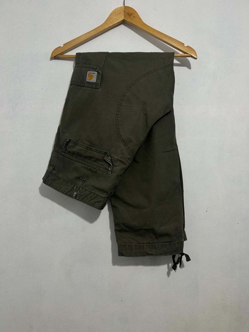 Carhartt Cargo Pants Olive Green (Category: Jeans) located in Davao. Submitted by msagatha (Listing ID 1445958308, Image 1). Description: - Classic olive green Carhartt cargo pants - Durable workwear design - Multiple functional pockets for storage - Adjustable ankle drawstrings - Ideal for everyday wear and outdoor activities.