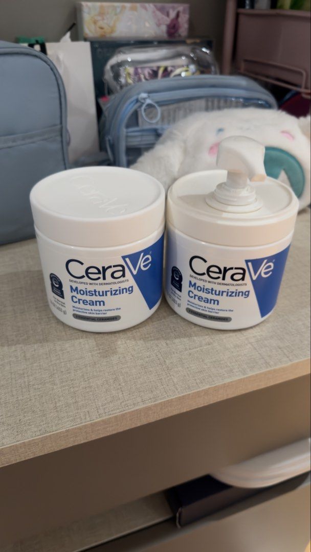 CeraVe Moisturizing Cream 2 Jars (1 UNOPENED + 1 OPENED) (Category: Face Care) located in Quezon City. Submitted by sunnydays21 (Listing ID 1445941871, Image 1). Description: - Two tubs of CeraVe Moisturizing Cream - One tub includes a convenient pump dispenser - Ideal for dry skin - Enriched with essential ceramides - Helps restore and maintain the skin's natural barrier - Suitable for both face and body.