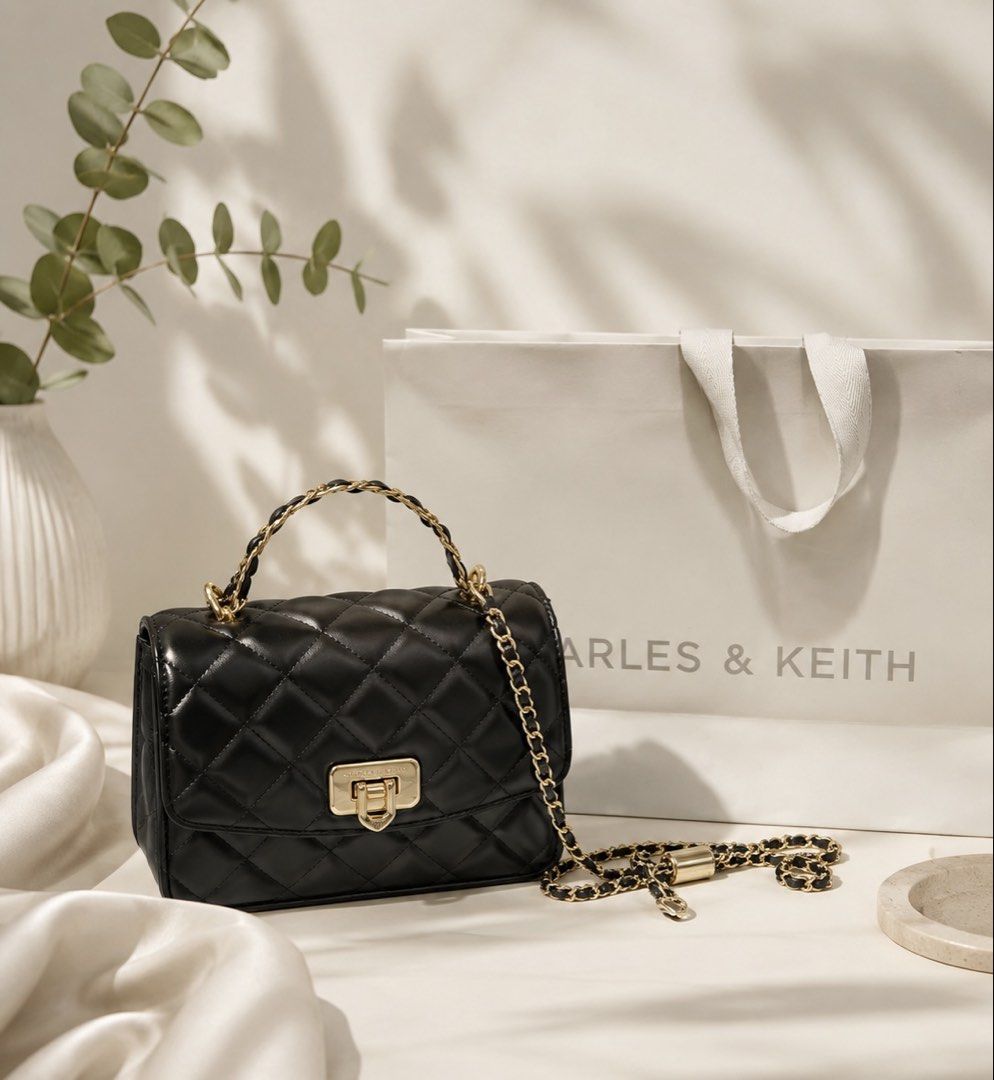 Charles & Keith Black Quilted Chain Shoulder Bag (Category: Shoulder Bags) located in Rizal. Submitted by dnlaaaa (Listing ID 1445972872, Image 1). Description: URGENT - Brand: Charles & Keith - Color: Black - Material: Quilted - Features: Gold chain strap, top handle, turn-lock closure - Style: Chic, classic - Versatility: Dress up or down - Capacity: Fits essentials *negotiable.