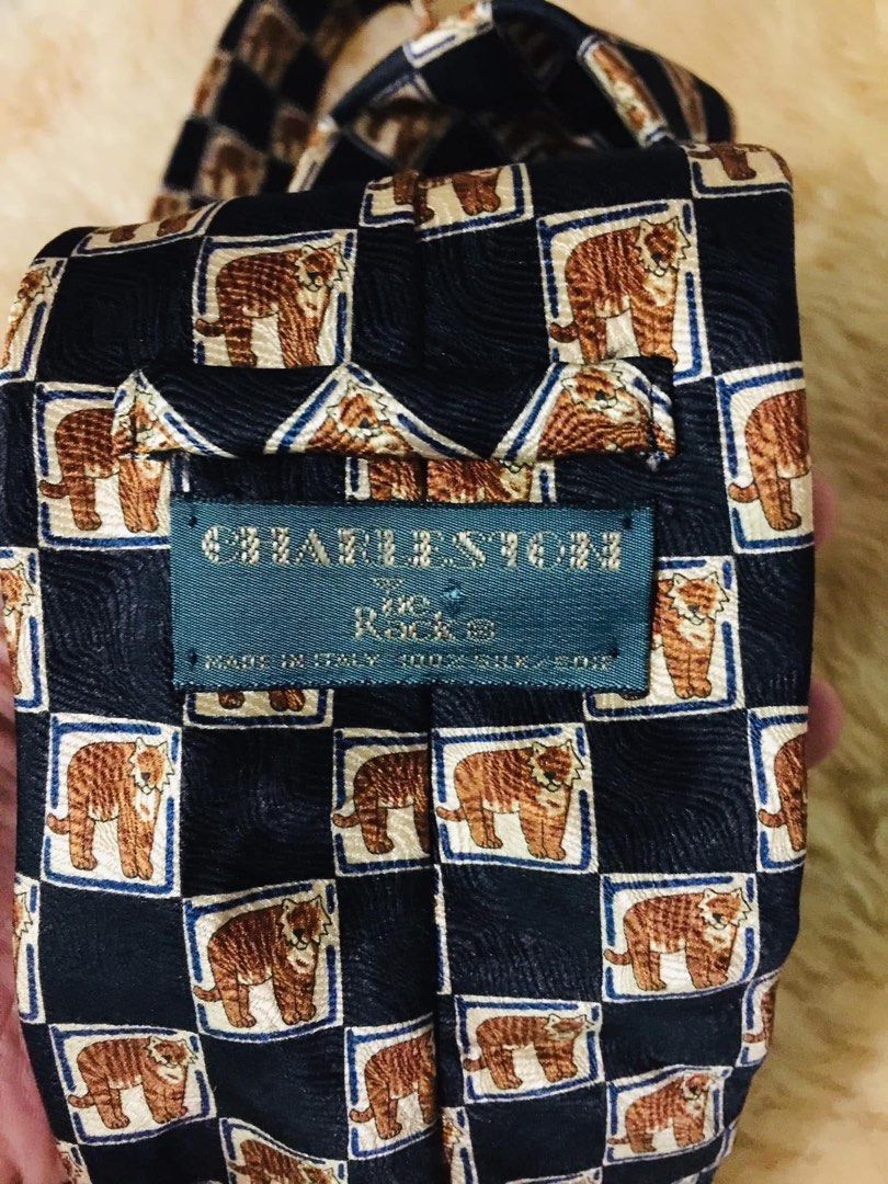 Charleston Tie Made in Italy 100% Silk Tiger Pattern (Category: Ties) located in Baguio. Submitted by izza_thrifty (Listing ID 1445879596, Image 3). Description: - Made in Italy - 100% Silk - Unique checkerboard pattern with tigers - Dark blue base color - Perfect for elevating any outfit.