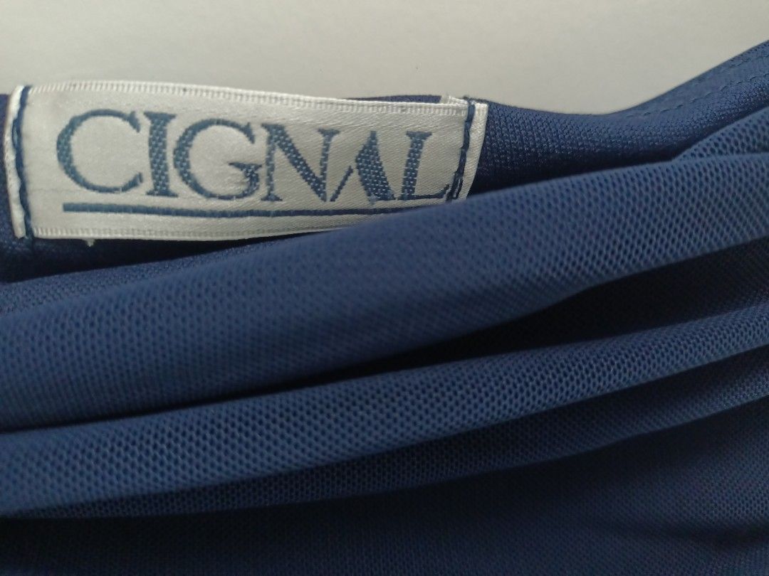 CIGNAL One-Shoulder Ruched Maxi Dress (Category: Dresses) located in Pasig City. Submitted by leaves21 (Listing ID 1445957254, Image 3). Description: - Brand: CIGNAL - fits sizes Small-Medium - Beautiful navy blue one-shoulder dress - stretchy fabric - Elegant ruching detail on the side - Fabric with a lovely drape at the back - Perfect for formal events or a night out - Invisible Side zipper closure - Floor-length hemline - with built-in padded 