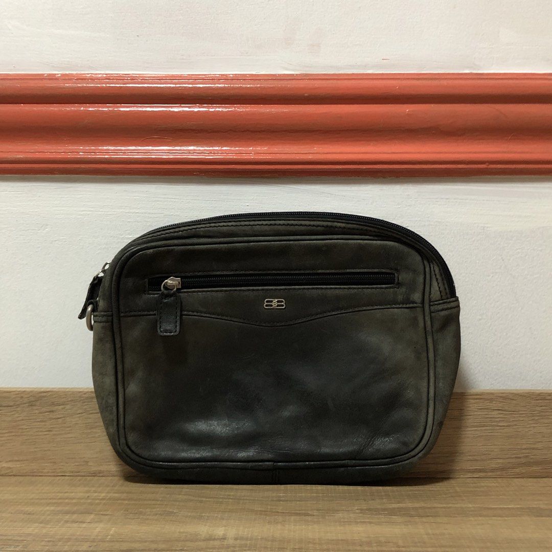 Classic Balenciaga BB Logo Leather Pouch (Category: Luxury Bags & Wallets) located in Marikina City. Submitted by miguelmalonzo (Listing ID 1440717520, Image 2). Description: Selling this classic, pre-loved piece. It features the iconic interlocking BB logo and a handy front zipper pocket. The leather has a beautiful, distressed vintage patina with minor edge scuffs. It looks amazing and is perfect for daily use. Condition: Great classic shape. Z