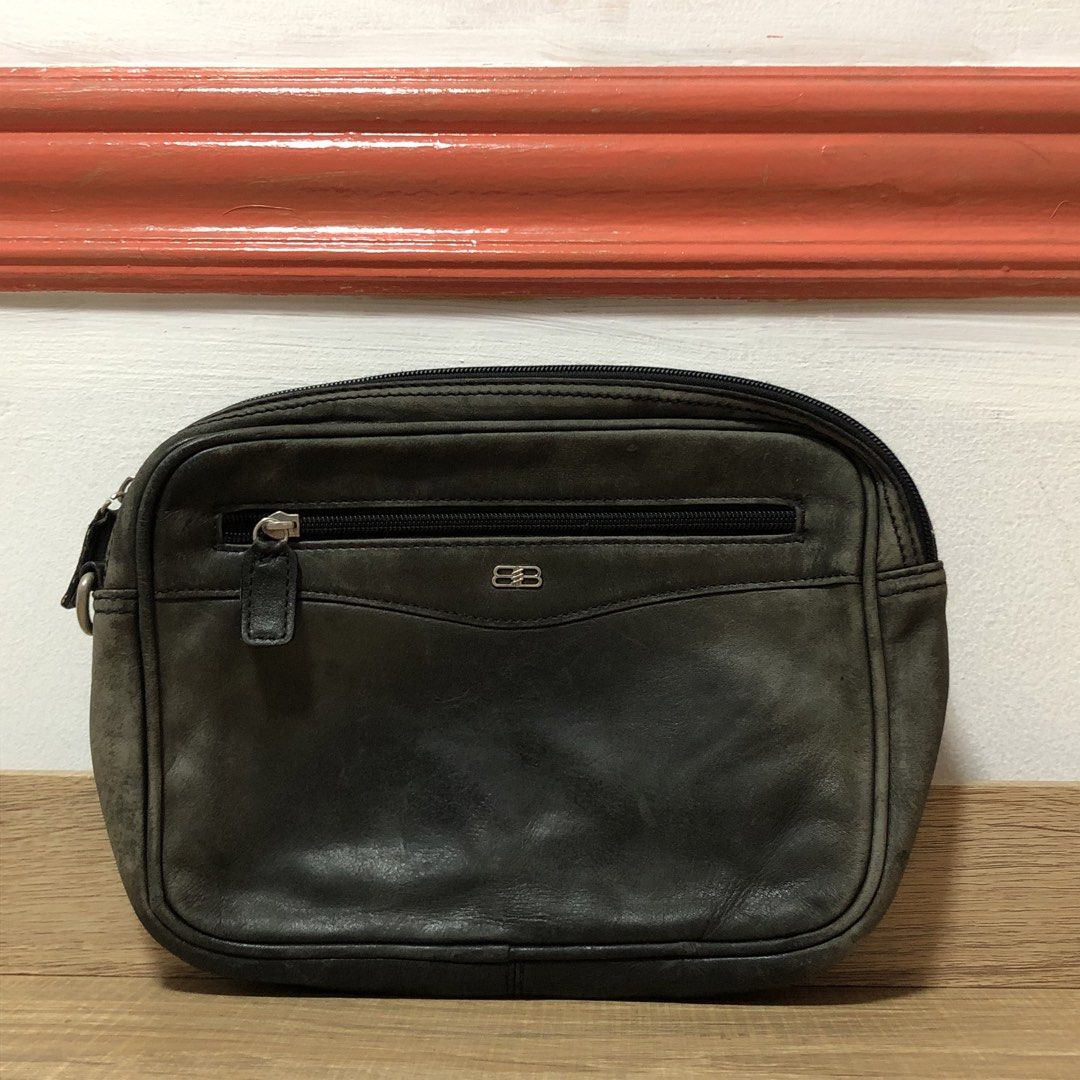 Classic Balenciaga BB Logo Leather Pouch (Category: Luxury Bags & Wallets) located in Marikina City. Submitted by miguelmalonzo (Listing ID 1440717520, Image 1). Description: Selling this classic, pre-loved piece. It features the iconic interlocking BB logo and a handy front zipper pocket. The leather has a beautiful, distressed vintage patina with minor edge scuffs. It looks amazing and is perfect for daily use. Condition: Great classic shape. Z
