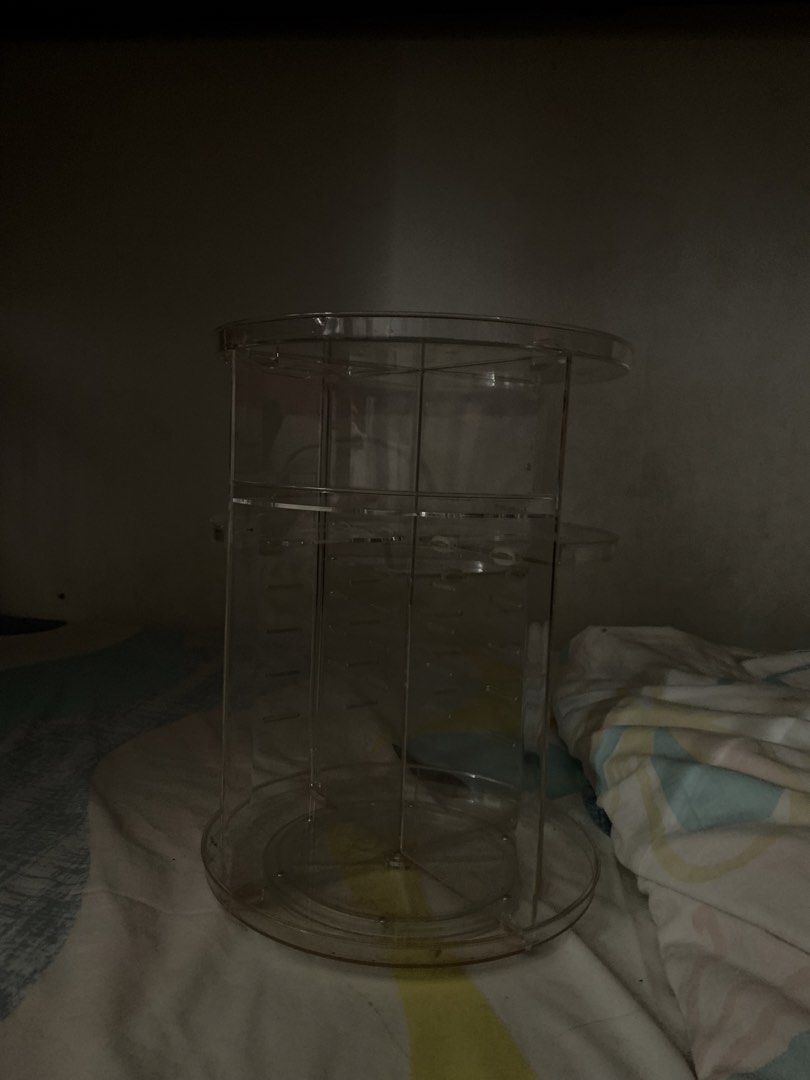 Clear Rotating Makeup Organizer (Category: Makeup) located in Las Pinas. Submitted by bookthrift_ (Listing ID 1445827040, Image 1). Description: - Clear acrylic makeup organizer - Spins 360 degrees for easy access - Multiple compartments for brushes, lipsticks, and more - Keeps your vanity tidy and organized - Perfect for all your beauty products.