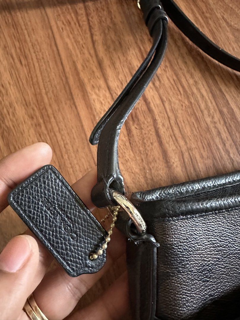 Coach Signature Monogram Crossbody Bag (Category: Luxury Bags & Wallets) located in Pasig City. Submitted by byeloved (Listing ID 1445865695, Image 2). Description: - Classic Coach crossbody bag - Signature brown and black monogram pattern - Genuine leather trim and strap - Secure zipper closure - Convenient small exterior pocketi - Ideal for everyday use - Features attached Coach leather tag.