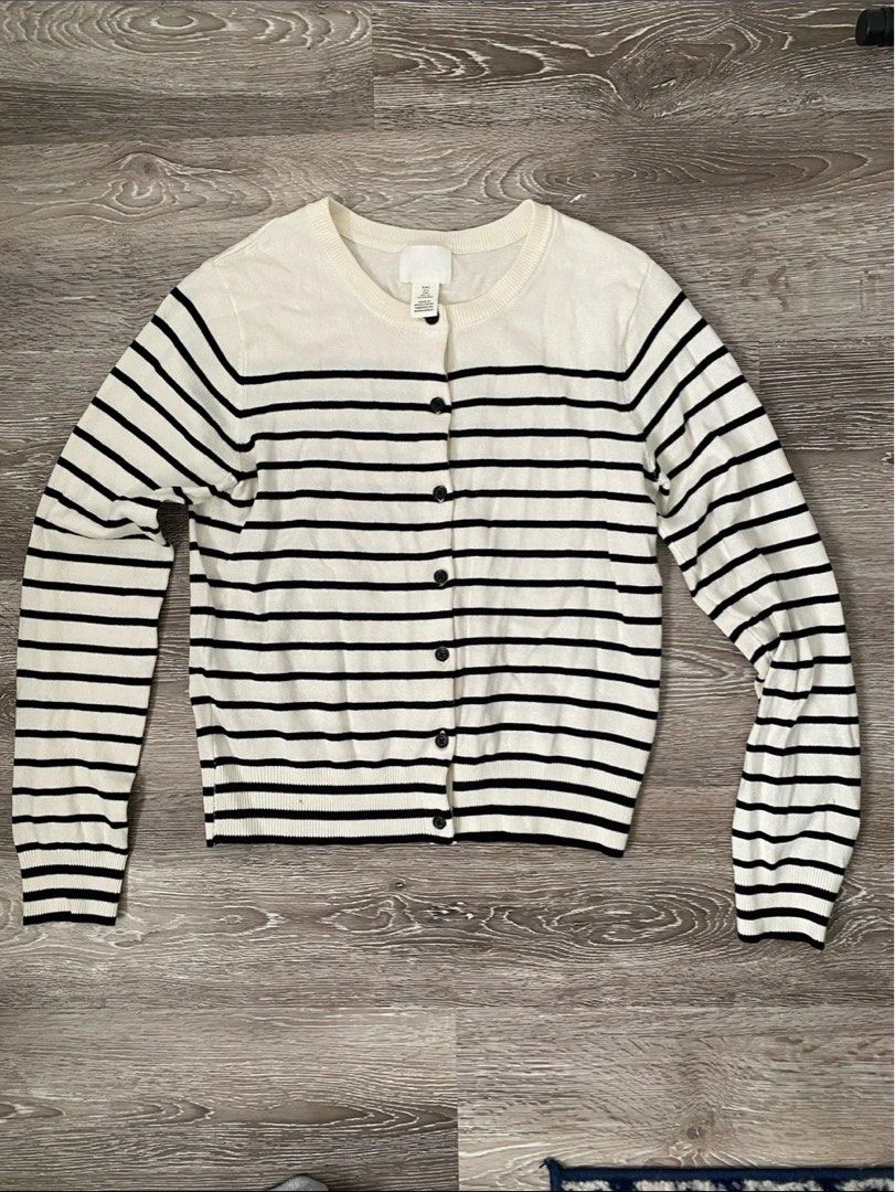Cream and Black Striped Button-Up Cardigan (Category: Coats, Jackets and Outerwear) located in Davao. Submitted by akushhla (Listing ID 1445943425, Image 1). Description: - Classic cream and black striped cardigan - Long sleeves - Button-up front - Estimated size: Small to Medium - Ideal for layering over tops or dresses - Versatile for casual or dressier looks.