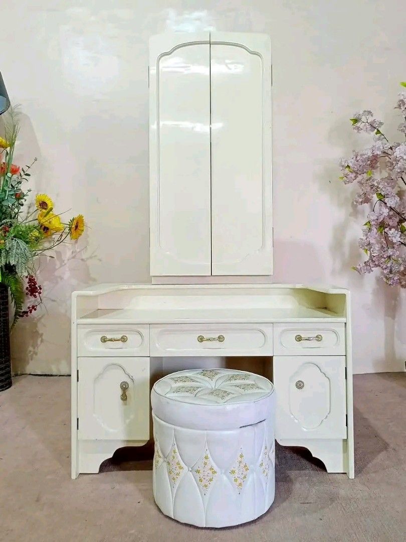 Cream Vanity Dressing Table with Stool and Mirror (Category: Tables & Sets) located in Manila. Submitted by eloizavill76462 (Listing ID 1445809771, Image 1). Description: White Elegant Trifold Mirror Vanity Dresser w/ Round Stool Storage 36”L x 15”W x 60”H.