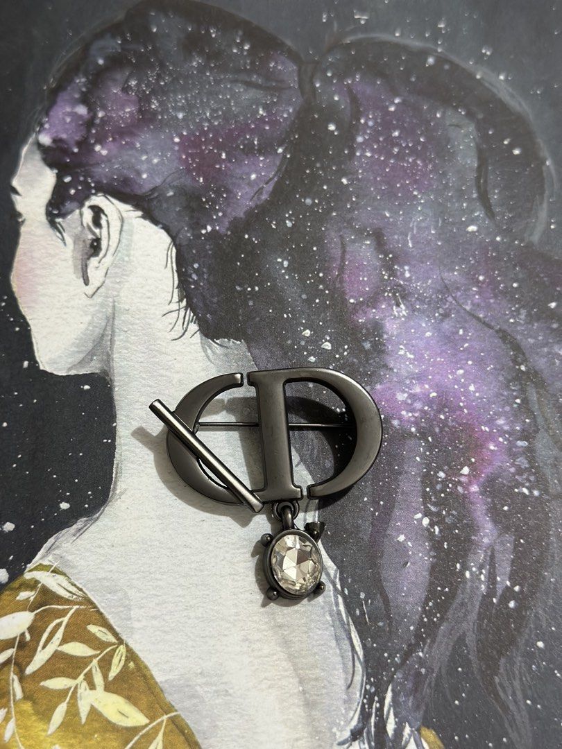 Dior CD Turtle Brooch with Crystal Accent (Category: Brooches) located in Naga. Submitted by bag.net (Listing ID 1445935646, Image 2). Description: - Dior CD brooch (Preloved from Japan) - Adorable turtle charm with clear crystal accent - Stylish dark grey/gunmetal finish - Secure pin closure on the back - Perfect accessory to elevate any outfit -fashionable And stunning!!!.