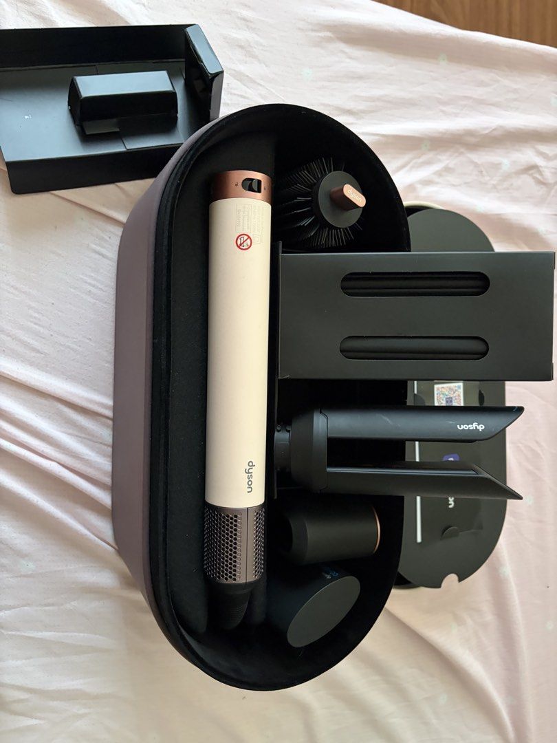 Dyson Co-anda 2x Airwrap (Category: Hair) located in Marikina City. Submitted by koletteyy (Listing ID 1445953886, Image 3). Description: - NO ANY FLAWS AT ALL - Used twice only - Excellent working condition (can pass as brand new) - Includes all attachments shown in photos - Comes with original storage case (no engraving) RFS: not using anymore FREE SF NO LOW BALLERS — WILL BLOCK.