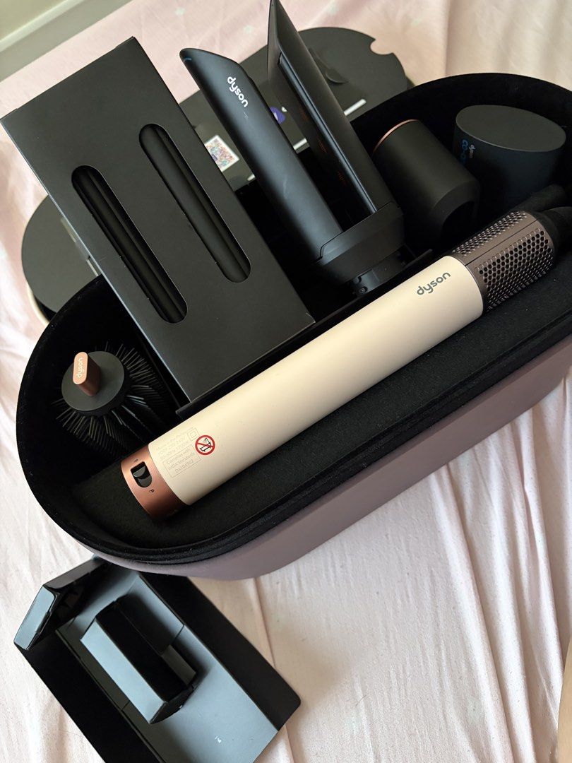 Dyson Co-anda 2x Airwrap (Category: Hair) located in Marikina City. Submitted by koletteyy (Listing ID 1445953886, Image 2). Description: - NO ANY FLAWS AT ALL - Used twice only - Excellent working condition (can pass as brand new) - Includes all attachments shown in photos - Comes with original storage case (no engraving) RFS: not using anymore FREE SF NO LOW BALLERS — WILL BLOCK.