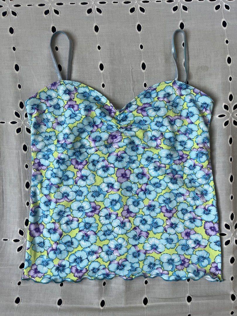 Floral Print Cami Top sleeveless (Category: Sleeveless) located in Cavite. Submitted by yanni_ci (Listing ID 1445824251, Image 1). Description: - Adorable floral print cami top - Light blue and purple flowers on a lime green background - Features a cute lettuce hem detail - Adjustable spaghetti straps for a perfect fit - Estimated size: Small (stretch up to large) - Ideal for creating stylish summer outfits.