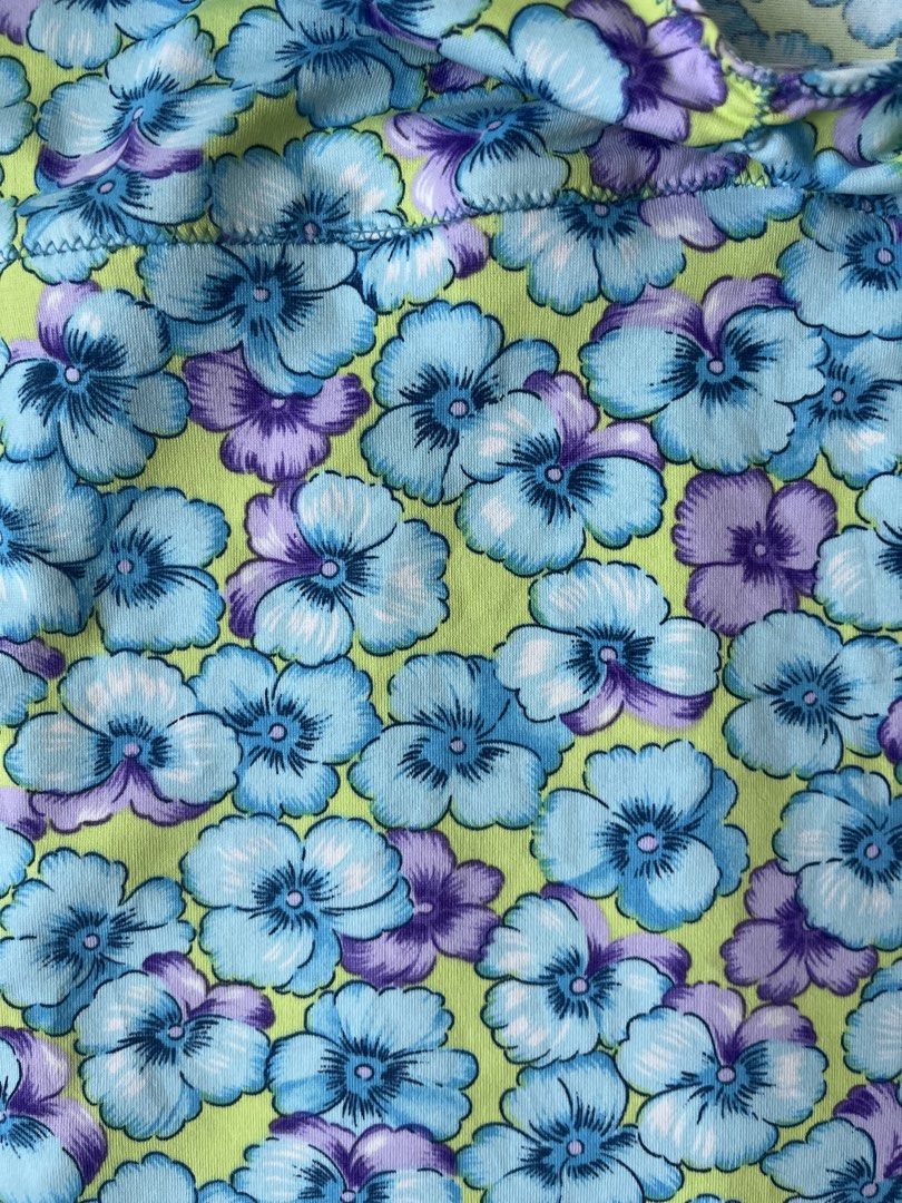 Floral Print Cami Top sleeveless (Category: Sleeveless) located in Cavite. Submitted by yanni_ci (Listing ID 1445824251, Image 3). Description: - Adorable floral print cami top - Light blue and purple flowers on a lime green background - Features a cute lettuce hem detail - Adjustable spaghetti straps for a perfect fit - Estimated size: Small (stretch up to large) - Ideal for creating stylish summer outfits.