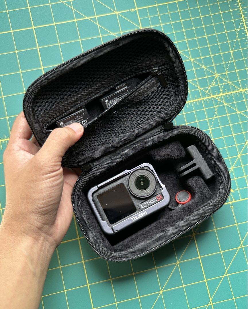 Flymile Action Camera Carrying Case (Category: Camera Bags & Carriers) located in Makati City. Submitted by changsversion (Listing ID 1445846524, Image 3). Description: Hard Shell Case for DJI Action Camera/ Insta360 Ace Pro 2 Missing: Strap and Carabiner Reason for selling: Not being used - Durable black hard shell case for action cameras - Interior mesh pocket for accessories - Molded interior for secure camera and battery storage.