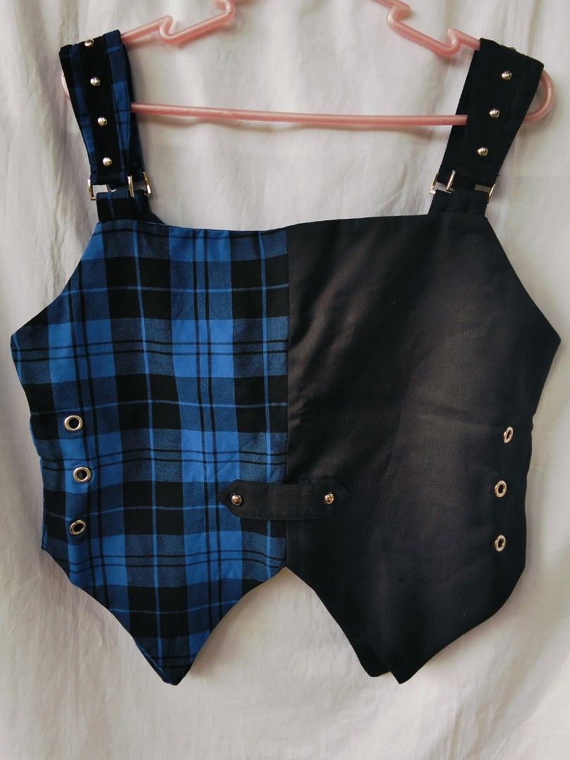 Goth Punk Plaid & Black Buckle Vest Top (Category: Sleeveless) located in Castillejos. Submitted by deannasaur (Listing ID 1445837366, Image 3). Description: - Split design: one side black faux leather, other side blue plaid - Adjustable straps for a custom fit - Buckle details for added style - Versatile: wear layered or on its own - Edgy punk/goth aesthetic bust: 36-38 .
