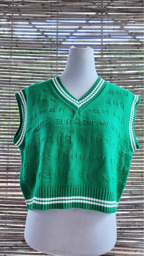 Green Alexander Wang Knit Sweater Vest (Category: Sleeveless) located in Paranaque City. Submitted by lhenlhen0021 (Listing ID 1445919101, Image 1). Description: - Green knit sweater vest - Features repeating Alexander Wang logo all over - V-neck with white striped trim - Cropped length with striped hem - Sleeveless design - Perfect for layering or wearing solo.