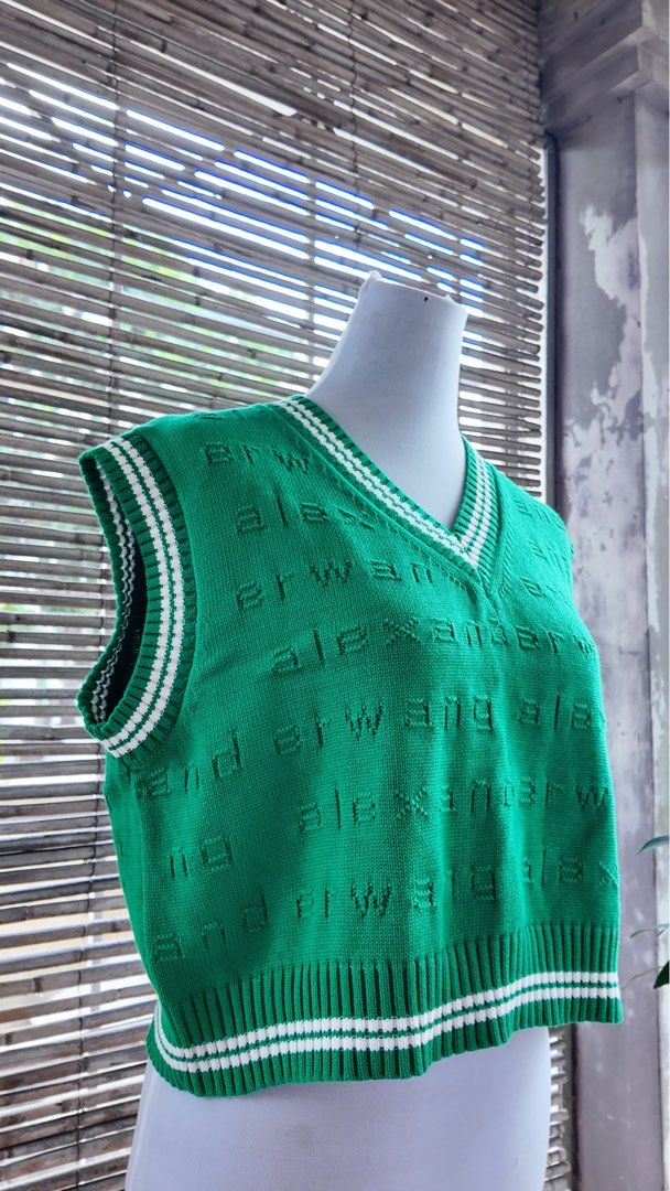 Green Alexander Wang Knit Sweater Vest (Category: Sleeveless) located in Paranaque City. Submitted by lhenlhen0021 (Listing ID 1445919101, Image 2). Description: - Green knit sweater vest - Features repeating Alexander Wang logo all over - V-neck with white striped trim - Cropped length with striped hem - Sleeveless design - Perfect for layering or wearing solo.