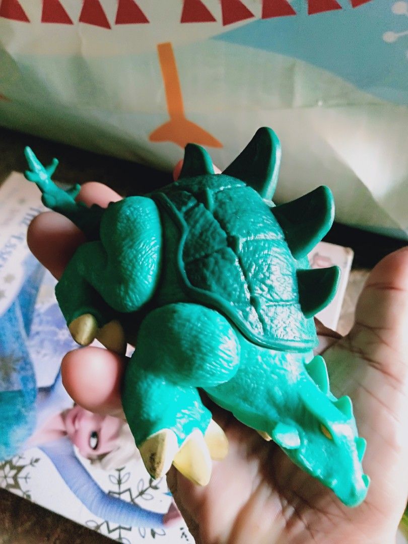 Green Dinosaur Toy Figure (Category: Kids Toys) located in Davao. Submitted by bravemoon_556cd5 (Listing ID 1445870241, Image 3). Description: - Green dinosaur toy - Features spikes on back and tail - Belly opens for extra fun - Encourages imaginative play for kids.