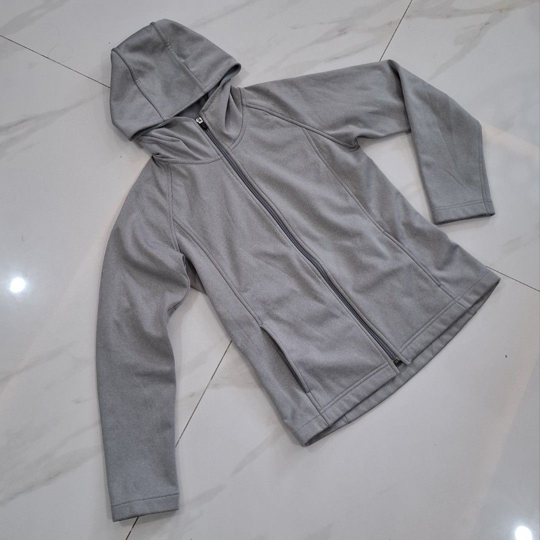 Grey Zip-Up Hoodie with Pockets (Category: Coats, Jackets and Outerwear) located in Bay. Submitted by r.thrift (Listing ID 1445853504, Image 2). Description: - Grey zip-up hoodie - Features a hood - Two front pockets - Simple and comfortable design - Ideal for casual wear or layering - Soft, easy-care material - A versatile wardrobe essential - Dimes L:23 W:17 -women size.