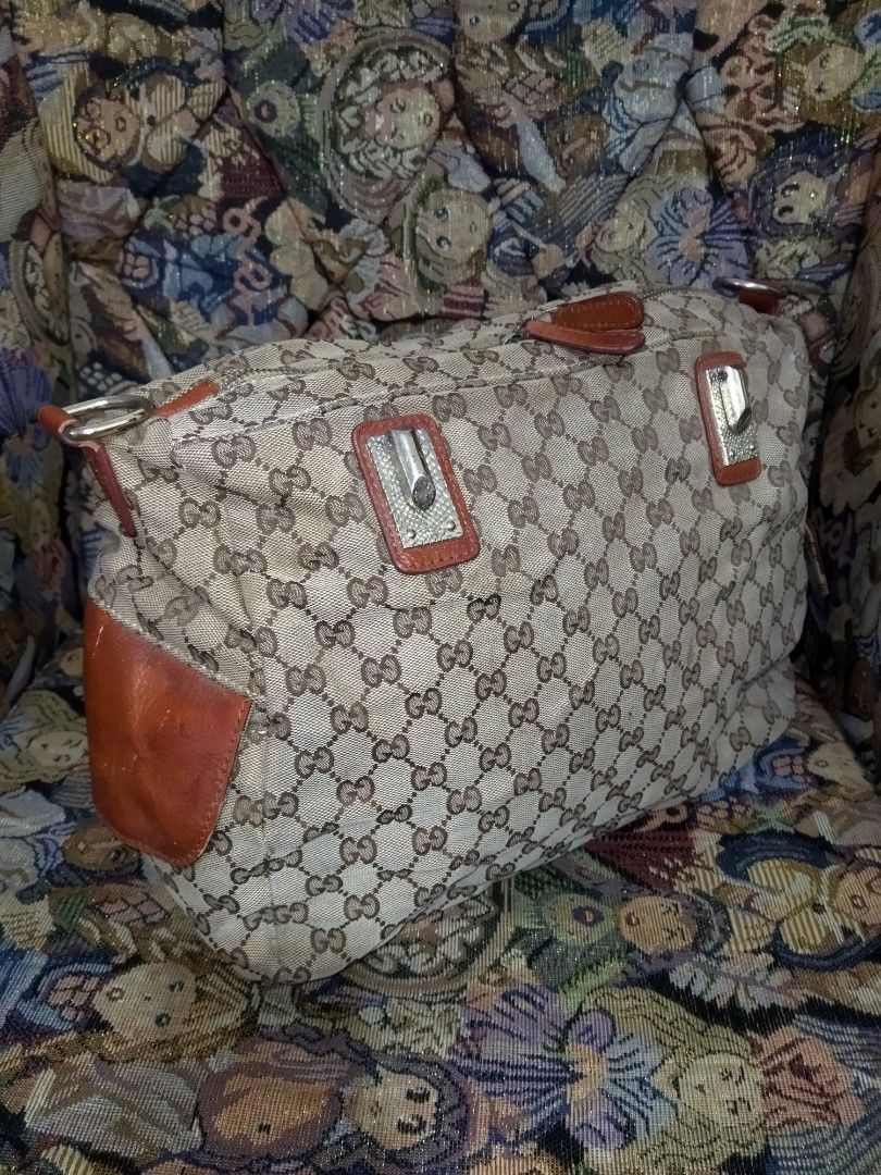 Gucci Monogram Canvas Leather Trim 2 way Bag (Category: Luxury Bags & Wallets) located in Santa Cruz. Submitted by madonnaching (Listing ID 1445820187, Image 1). Description: - Authentic Gucci 2way bag (project bag) - Classic GG monogram canvas - Brown leather trim and handles - Zipper closure - Interior zip pocket - Made in Italy - Great everyday bag no handle and sling.