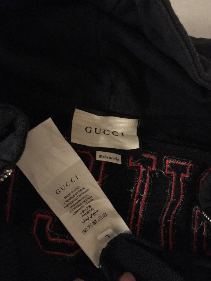 Gucci Navy Blue Zip-Up Hoodie (Category: Coats, Jackets and Outerwear) located in Pasig City. Submitted by devlux (Listing ID 1445926009, Image 2). Description: - Authentic Navy Blue Gucci Hoodie - Iconic Gucci logo on chest and back - Zip-up front with pockets - Made in Italy - Size: L - Approximate Measurements: 23 inches (width) x 26 inches (length).