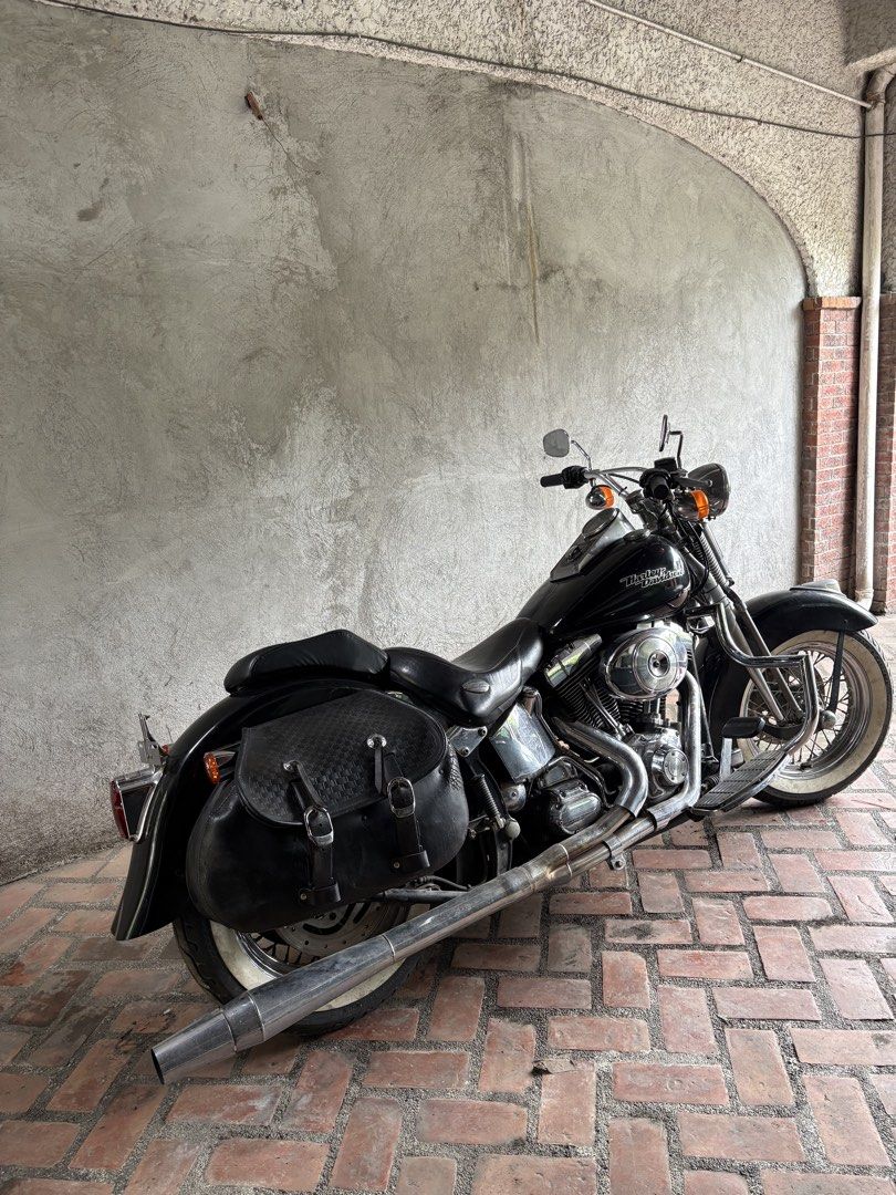 Harley-Davidson Motorcycle with Saddlebags (Category: Motorbikes for Sale) located in Quezon City. Submitted by 33mdmc (Listing ID 1445850812, Image 2). Description: Classic black Harley-Davidson motorcycle. Equipped with leather saddlebags for storage. Whitewall tires add to the vintage look. Chrome accents throughout. Ready for the road. Great for cruising..