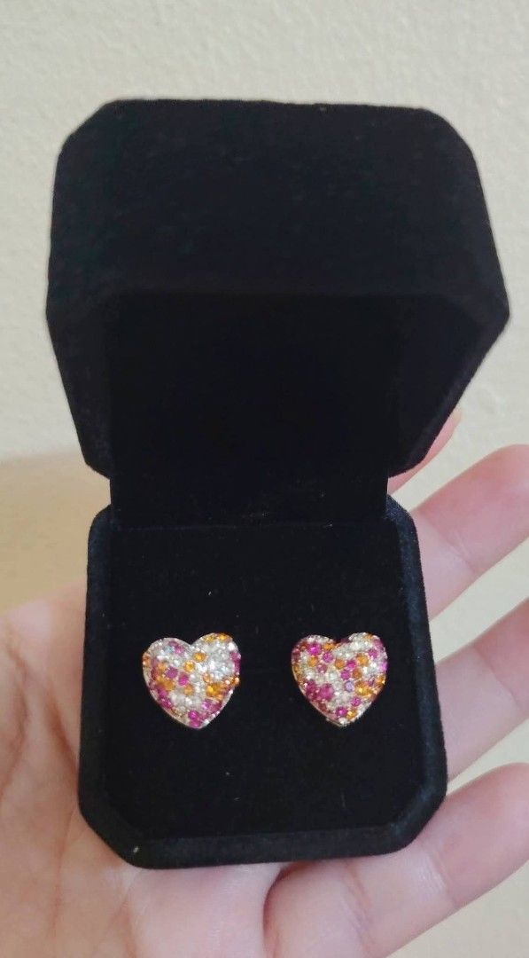 Heart Shaped Stud Earrings with Colorful Gems (Category: Earrings) located in Baguio. Submitted by thrifty_cool (Listing ID 1445796372, Image 1). Description: - Cute heart-shaped stud earrings - Adorned with small, colorful gems (pink, orange, clear) - Includes a black velvet jewelry box - Perfect for adding a pop of color - Features secure screw-on backs.