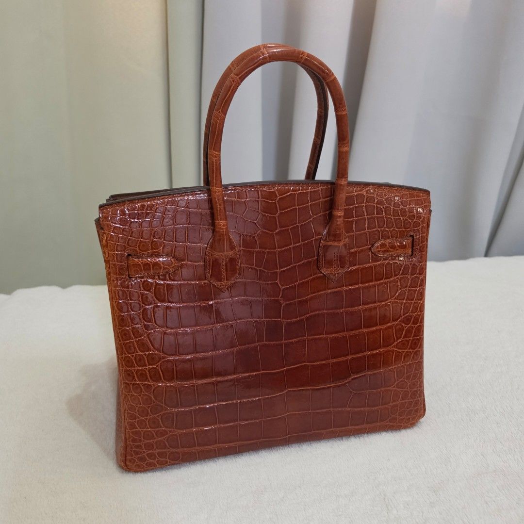 Hermes Birkin 30 Veau Croc Miel (Category: Purses & Pouches) located in Paranaque City. Submitted by bic_350 (Listing ID 1445801006, Image 2). Description: CLEARANCE!! Croc leather niloticus, no cites size 30 with dustbag, key clochet, padlock and box sobrang ganda in person welcome to DM..
