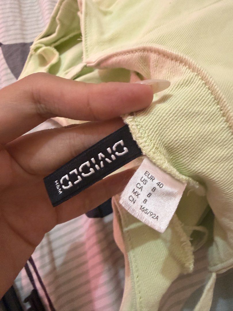 H&M Divided Light Green Denim Mini Dress (Category: Dresses) located in Manila. Submitted by lifeofchamppreloved (Listing ID 1445815330, Image 3). Description: - Light green denim mini dress - Brand: H&M Divided - Features spaghetti straps and a side zipper - Minor marks on fabric (visible in the last photo).