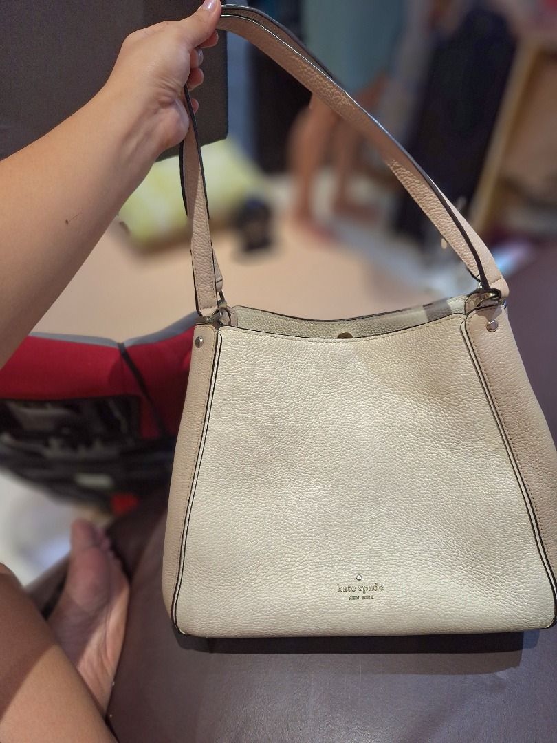 Kate Spade Beige Leather Shoulder Bag (Category: Luxury Bags & Wallets) located in Quezon City. Submitted by camille_cr (Listing ID 1445875425, Image 1). Description: - Bought at Greenbelt Makati - Orig price 14k - Leila Medium Triple Compartment Shoulder Bag - Authentic Kate Spade shoulder bag - Color: Beige leather with a contrasting lighter panel - Interior: Multiple compartments, including a zippered pocket - Spacious enough for all your esse