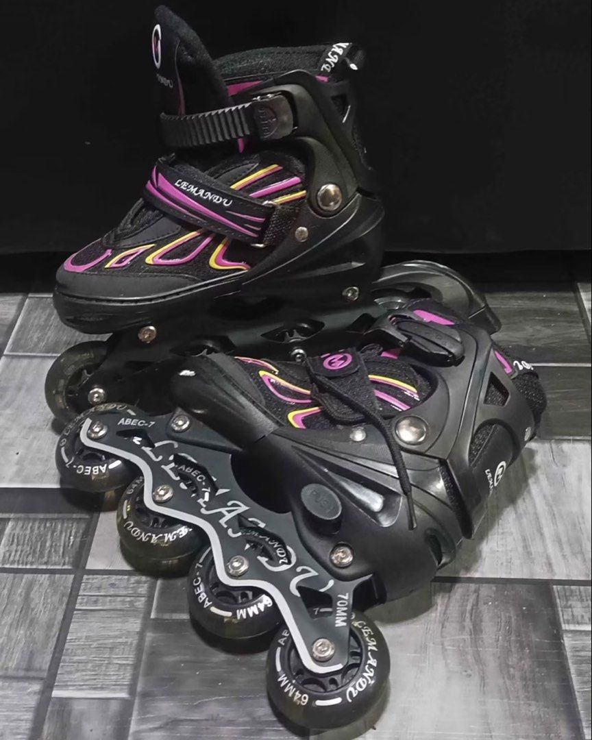 L'EMANDU Inline Skates - Adjustable Size (Category: Skates, Rollerblades & Scooters) located in Baguio. Submitted by thrifty_cool (Listing ID 1445879387, Image 2). Description: - Brand: L'EMANDU - Color: Black and Pink - Wheel Size: 70mm (front) and 64mm (rear) - Bearings: ABEC-7 - Features: Adjustable sizing, secure straps and laces - Ideal for: Beginners and casual skaters.
