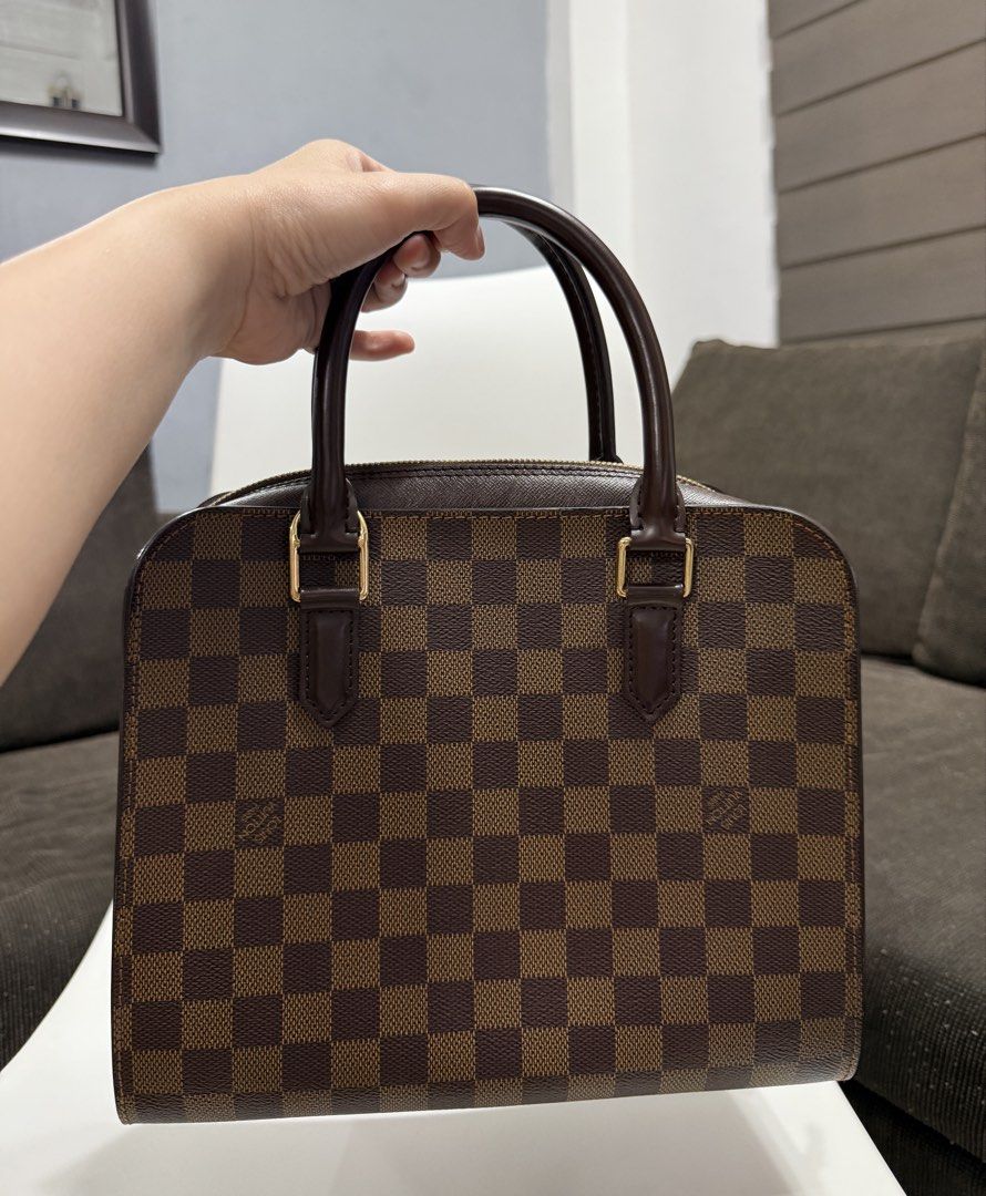 Louis Vuitton Damier Ebene Triana Handbag (Category: Luxury Bags & Wallets) located in Manila. Submitted by thecuratedfind (Listing ID 1445924954, Image 2). Description: - Vintage Louis Vuitton Damier Ebene Triana - Damier Ebene canvas - Gold hardware and zip closure - Red interior with pockets - Comes with dust bag - LegitGrails certificate included.