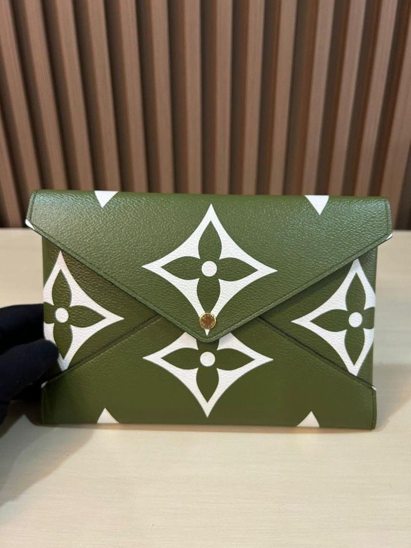 Preloved Louis Vuitton Kirigami Pochette (Category: Luxury Bags & Wallets) located in Paranaque City. Submitted by Sofia.0228 (Listing ID 1445860520, Image 1). Description: some minor issues but the rest are in excellent condition - Authentic Louis Vuitton Pouch - Color: Khaki Green with White Monogram Print - Interior: Leather with Snap Closure - Origin: Made in France - Serial Number: SF3188 - Ideal for organizing essentials.