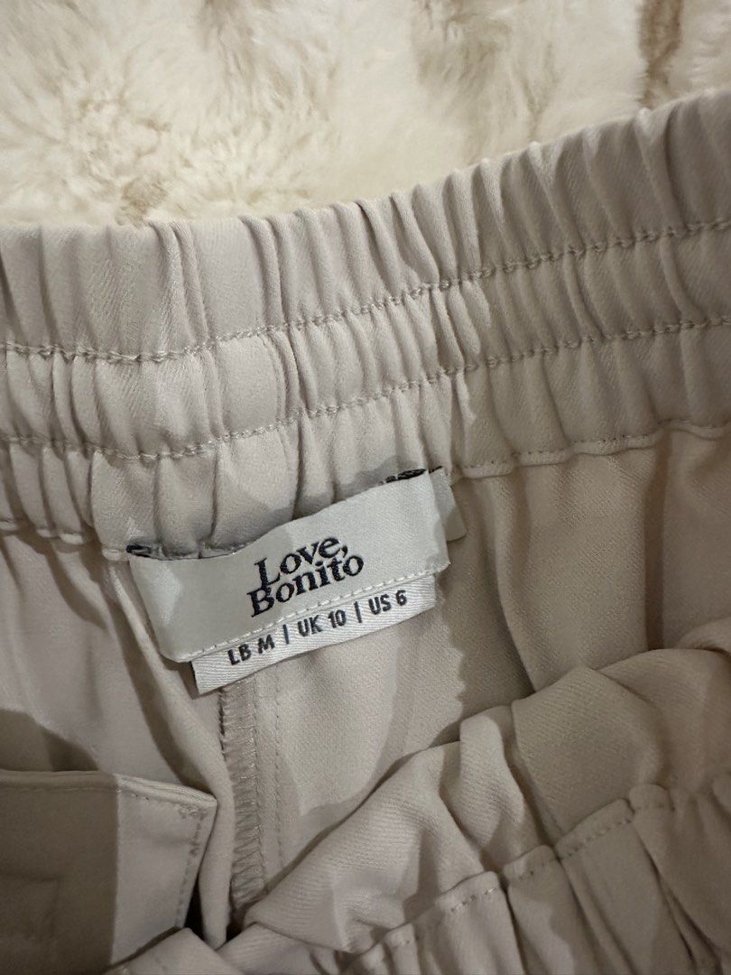 Love, Bonito Beige Elastic Waist Drawstring Shorts Size M (Category: Shorts) located in Manila. Submitted by alemanysof97766 (Listing ID 1445899852, Image 2). Description: - Beige shorts from Love, Bonito - Size M - Elastic waistband with drawstring - Relaxed fit - Ideal for casual wear - Versatile and easy to pair with various tops.