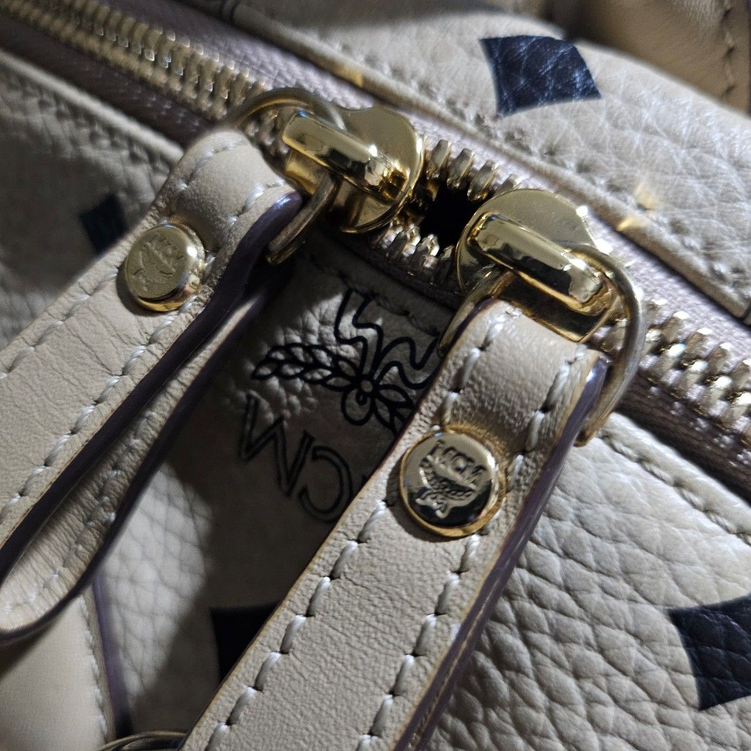 MCM Backpack Beige (Category: Luxury Bags & Wallets) located in Manila. Submitted by mystar0411 (Listing ID 1445908025, Image 2). Description: - Classic MCM backpack in beige - All-over monogram print - Gold hardware details - Top handle and adjustable straps - Zippers work smoothly - Minor signs of wear on leather trim and corners - Interior is clean - Perfect for everyday use.