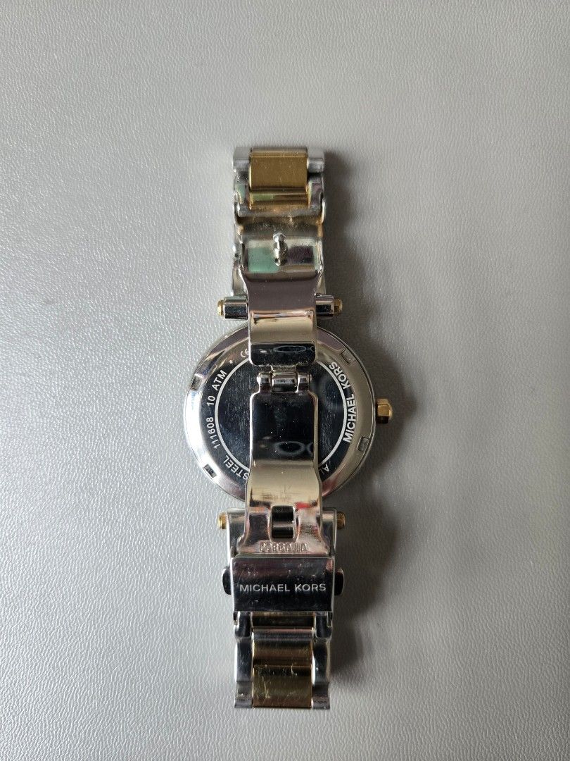 Michael Kors Two-Tone Chronograph Watch (Category: Luxury Watches) located in Quezon City. Submitted by mgdeclutters (Listing ID 1445849063, Image 3). Description: - Michael Kors Two-Tone Watch (Gold & Silver Stainless Steel) - White Dial with Chronograph Functions - Bezel encrusted with small stones - Water Resistant up to 10 ATM - Secure Clasp - Versatile for everyday or dressy wear.