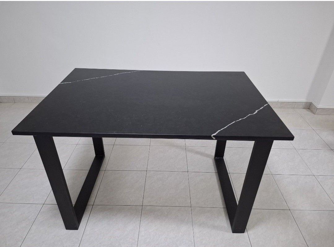 Solid marble Black Dining Table (Category: Tables & Sets) located in Singapore. Submitted by aipha (Listing ID 1445983655, Image 3). Description: - 120cm by 80cm. 2 units - Sleek black marble dining table - Tabletop with subtle white marble-like veining - Sturdy black metal legs for an industrial look - Comfortably seats 4-6 people - Versatile for dining rooms or as a workspace.