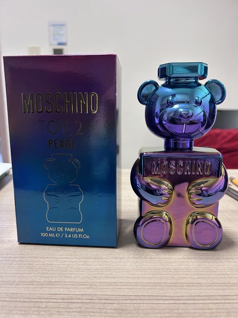 Moschino Toy 2 Pearl Eau de Parfum 100ml (Category: Fragrance & Deodorants) located in Angeles City. Submitted by mycl0set (Listing ID 1445891144, Image 2). Description: - Moschino Toy 2 Pearl Eau de Parfum - 100ml bottle - Comes in original box - Unique teddy bear bottle design - Pearlescent, iridescent finish - Ideal for collectors or as a gift.