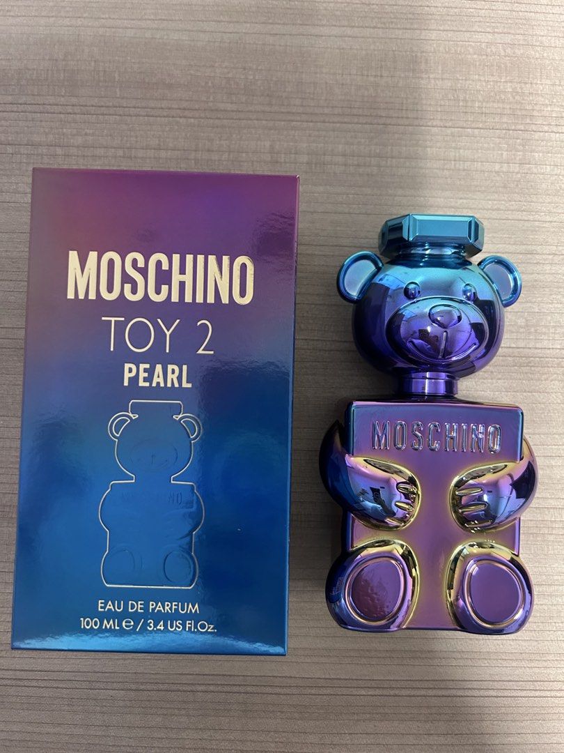 Moschino Toy 2 Pearl Eau de Parfum 100ml (Category: Fragrance & Deodorants) located in Angeles City. Submitted by mycl0set (Listing ID 1445891144, Image 1). Description: - Moschino Toy 2 Pearl Eau de Parfum - 100ml bottle - Comes in original box - Unique teddy bear bottle design - Pearlescent, iridescent finish - Ideal for collectors or as a gift.