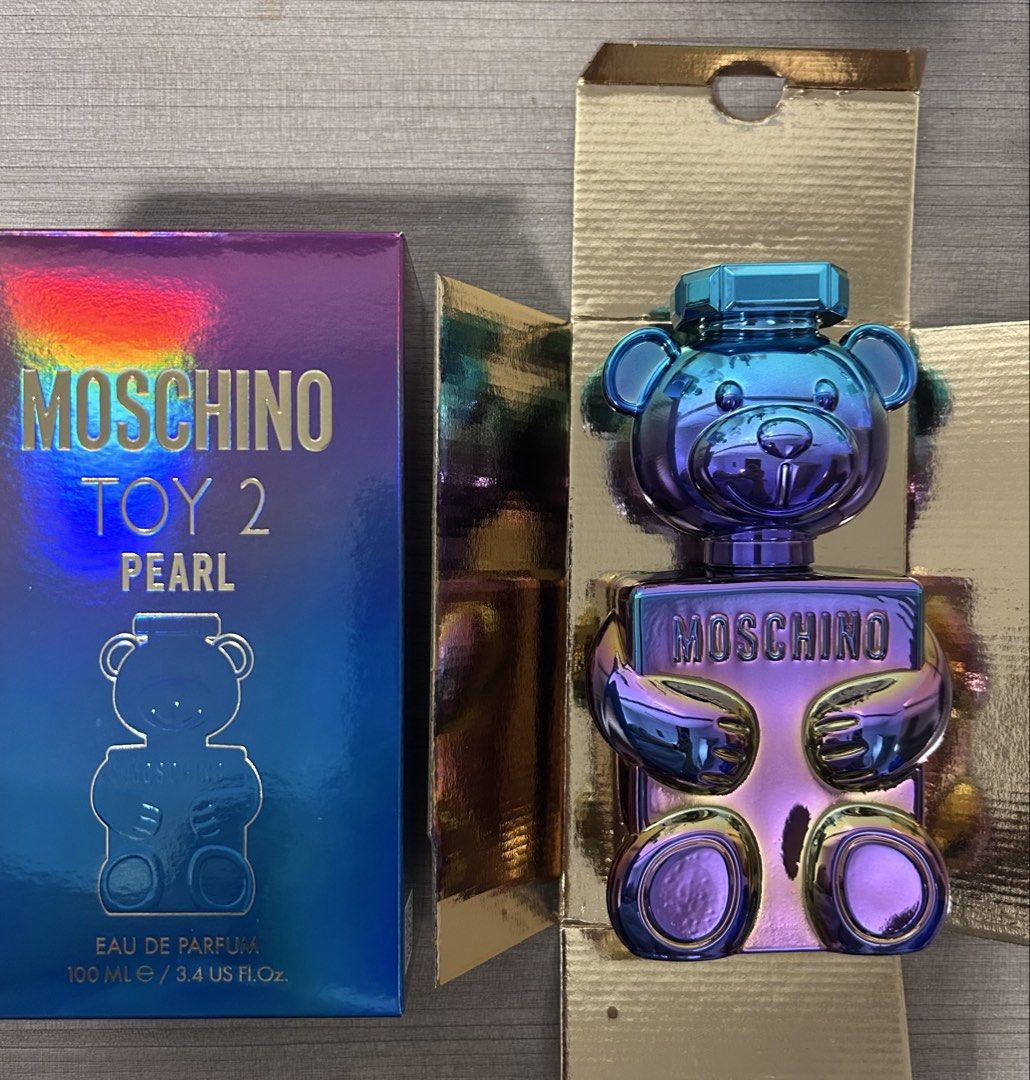 Moschino Toy 2 Pearl Eau de Parfum 100ml (Category: Fragrance & Deodorants) located in Angeles City. Submitted by mycl0set (Listing ID 1445891144, Image 3). Description: - Moschino Toy 2 Pearl Eau de Parfum - 100ml bottle - Comes in original box - Unique teddy bear bottle design - Pearlescent, iridescent finish - Ideal for collectors or as a gift.