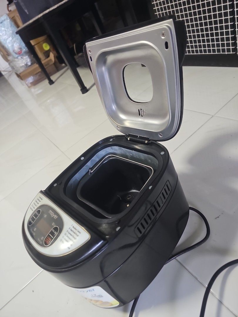 Multi-function Bread Maker - 12 Programs (Category: Breadmakers) located in Singapore. Submitted by petermint (Listing ID 1445889199, Image 3). Description: - 12-in-1 Bread Maker: Bake various breads (common, graham, French), cakes, jam, and yogurt. - Advanced Functions: Includes rapid knead, ferment dough, bake, and heat options. - User-Friendly Controls: Easy selection of pre-set programs, crust color, and start/stop. - Effortless Homemade Baki