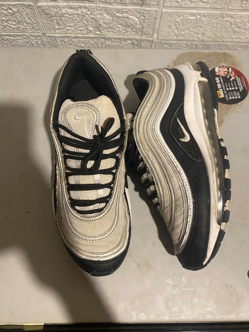 Nike Air Max 97 Silver Bullet | US 8 | Needs Wash | Preloved (Category: Casual Shoes) located in Pasay City. Submitted by classicph. (Listing ID 1445938469, Image 1). Description: Brand: Nike Model: Air Max 97 "Silver Bullet" Size: US 8 / EU 41 / 26cm Color: Silver/Black/White Condition: 6/10 - Need wash lang, may signs of use pero no major flaws Details: Full-length Air Max unit, mesh + synthetic upper, iconic wave design, black laces. Issue: Ne