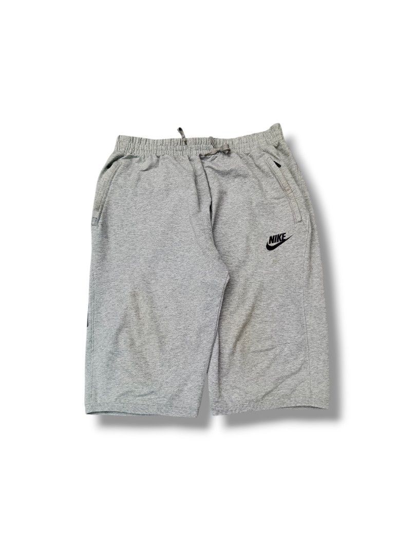 Nike Grey Sweatshirt & Shorts Set - Size 2XL (Category: Activewear) located in Rizal. Submitted by thriftbycho (Listing ID 1445806717, Image 3). Description: - Grey Nike sweatshirt and shorts set - Size: 2XL - Sweatshirt features unique blue and white graphic details on sleeve and chest - Shorts have a small Nike logo - Ideal for casual wear or workouts - Nike overall - Nike sweatshirt - Nike sweatshort - Nike grey set.
