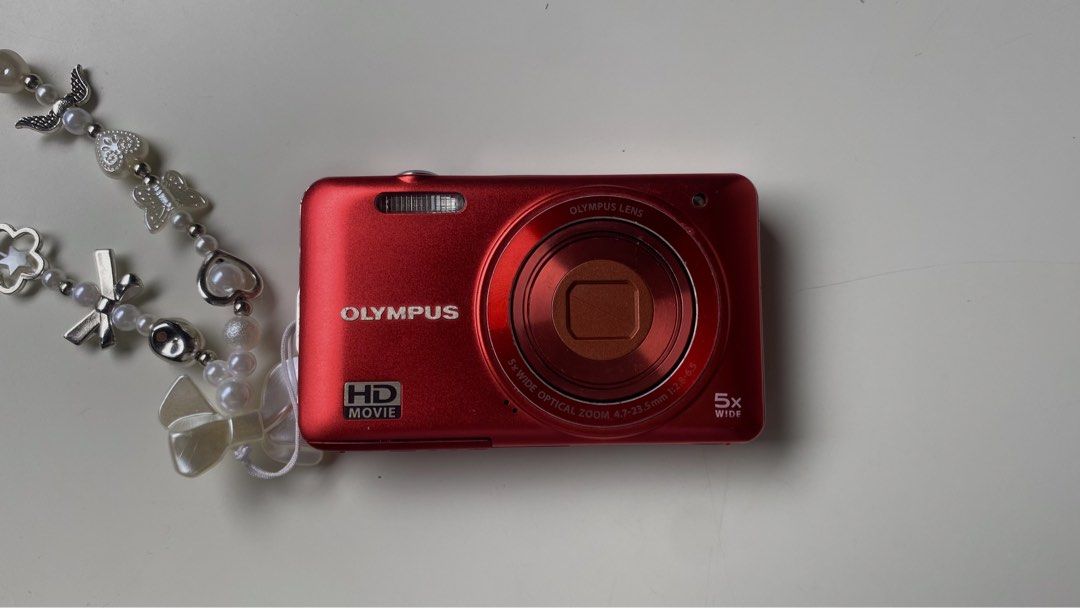 Olympus VG-160 Digital Camera (Category: Cameras) located in Manila. Submitted by simsmods (Listing ID 1445896614, Image 1). Description: Olympus VG-160 Red Great Budget Digital Camera - Working Flash - 14MP Built-in for a clean mid-2000 look - Comes with a 4GB card for quick data transfer Inclusions: ✅ Olympus LI-70C Charger ✅ Battery ✅ 4GB Memory Card Issues: - buttons doesn't work but can take pics. PM for more information .