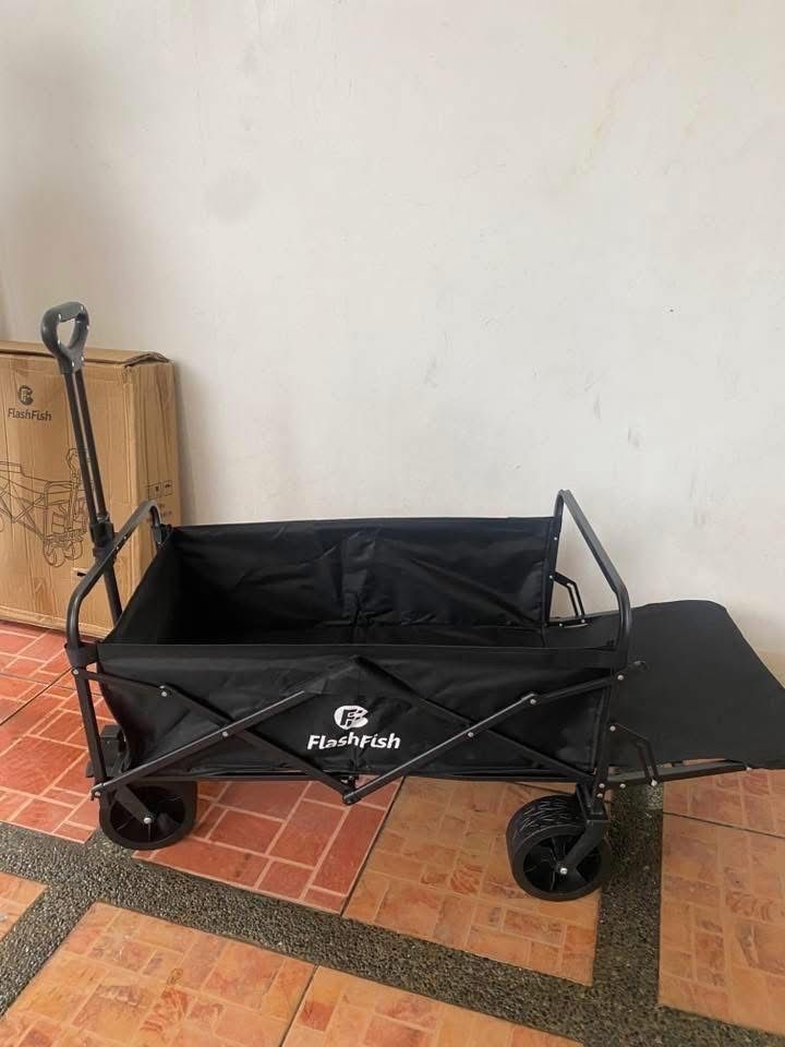 Open rear type Camping Wagon with Tabletop (Category: Hiking & Camping) located in Manila. Submitted by shairatorres (Listing ID 1445824915, Image 2). Description: - FlashFish Folding Wagon in Black - Versatile: Ideal for camping, beach trips, picnics, or hauling gear - Removable Tabletop: Doubles as a convenient table - Easy Storage: Folds compactly for effortless transport and storage - Durable Wheels: Built for sturdy and reliable use - Includ