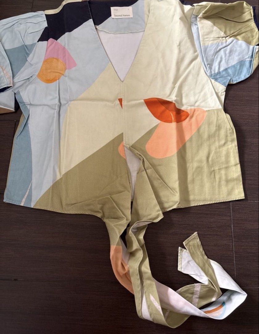 Our Second Nature Wrap Top (Category: Blouses) located in Pasig City. Submitted by blt78 (Listing ID 1445867759, Image 2). Description: Size Small Used thrice only! Original price is around 4k Bought in Singapore.