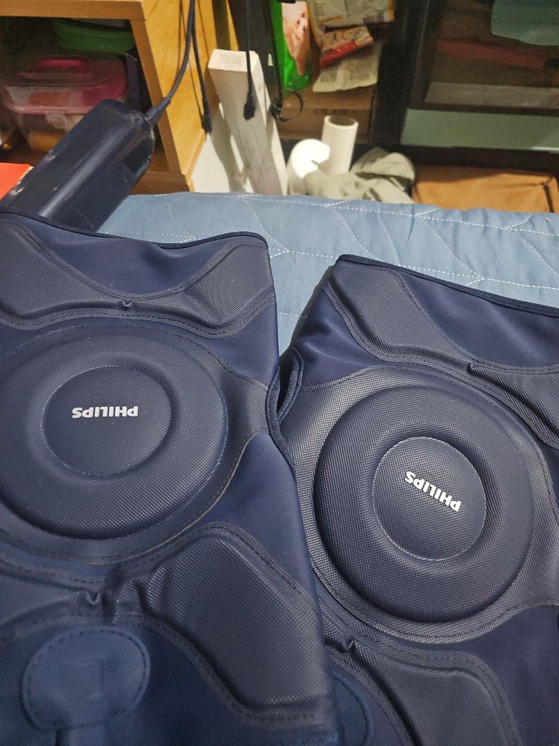Philips Knee Massage Device with Controller (Category: Massage Devices) located in Manila. Submitted by jtlim516 (Listing ID 1445917403, Image 2). Description: - Philips massage device in dark blue - Comes with an easy-to-use controller - Multiple settings: adjustable intensity and modes - Perfect for relaxation and muscle relief - Lightly used, in good working condition.
