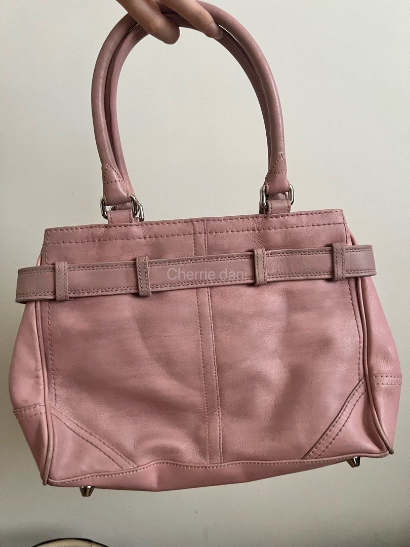 Pink Leather Handbag Project Bag (Category: Luxury Bags & Wallets) located in Manila. Submitted by cherrie_dani (Listing ID 1445660380, Image 2). Description: LAST PRICE POSTED Read first before chatting: - Paint over project - Cute pink leather handbag - Silver hardware details on the front - Top handles for easy carrying - Spacious interior for essentials - Versatile: perfect for everyday or a night out - Shows some signs of wear on handles and