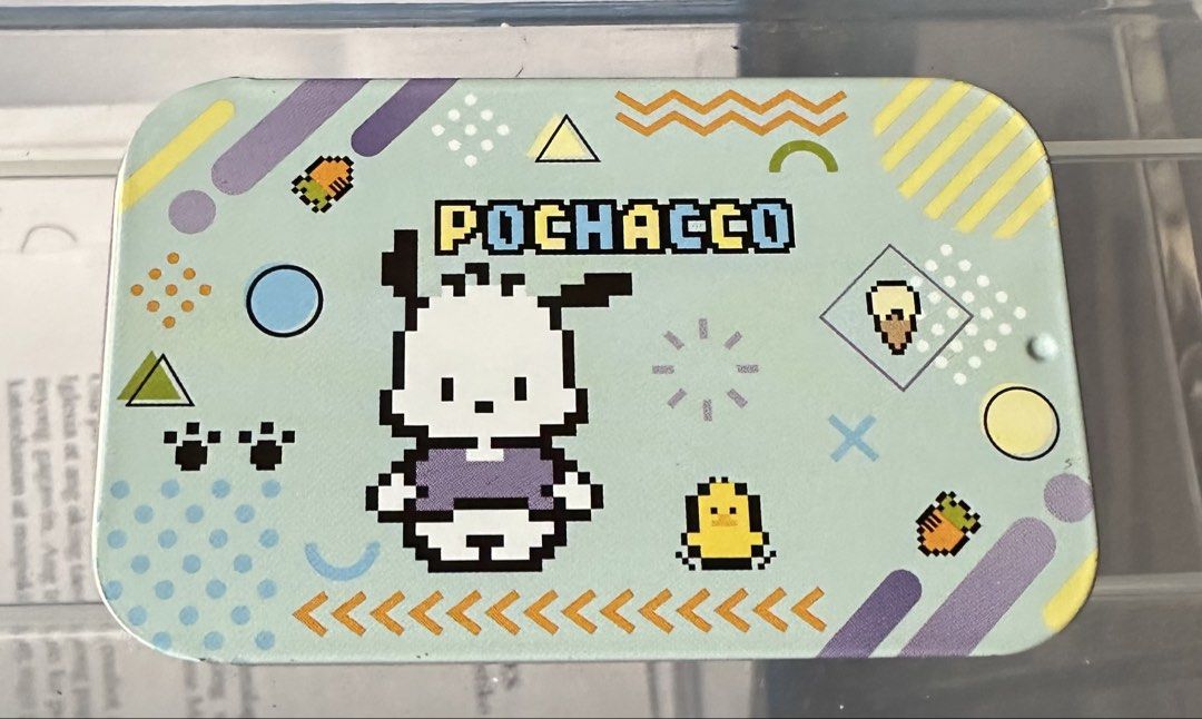 Pochacco Pixel Art Tin Box (Category: Storage Boxes & Baskets) located in Quezon City. Submitted by mitchapple88 (Listing ID 1445835391, Image 1). Description: - Adorable Pochacco tin featuring a unique pixel art design. - Showcases Pochacco, a chick, and ice cream graphics. - Decorated with fun geometric shapes and patterns. - Ideal for organizing small stationery, trinkets, or collectibles. - A perfect gift for any Sanrio or Pochacco enthusiast