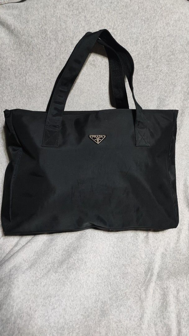Prada Black Nylon traveling Bag (Category: Luxury Bags & Wallets) located in Baguio. Submitted by ozara.06 (Listing ID 1445806467, Image 1). Description: Prada Traveling bag XL size May minimal bubbles sa sides 800.